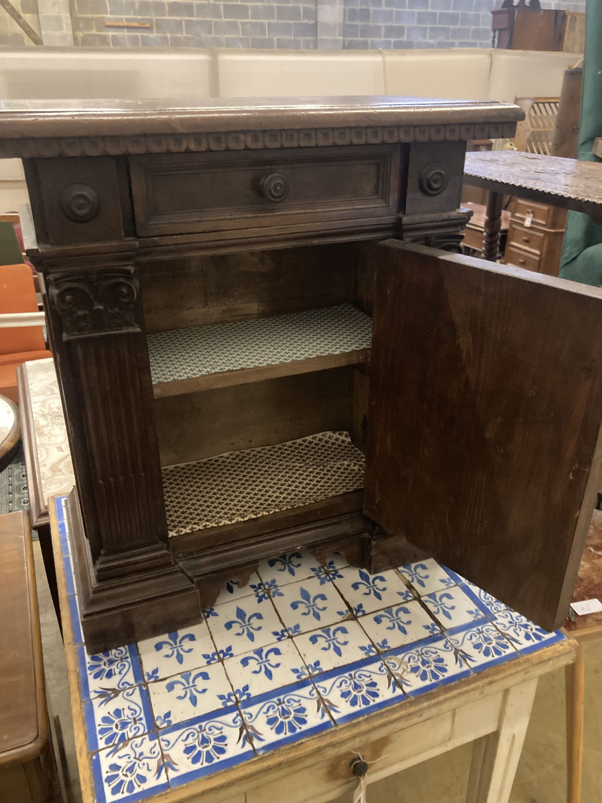 An Italian walnut cupboard, width 68cm depth 32cm height 73cm